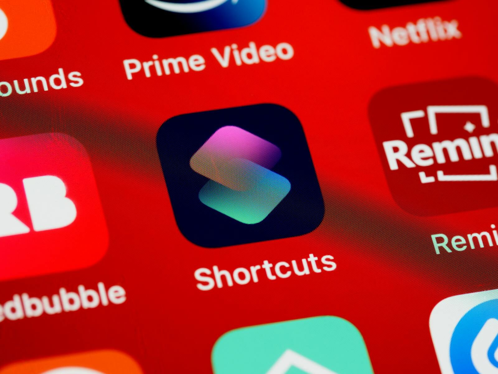 Close-up view of various app icons on a smartphone home screen.